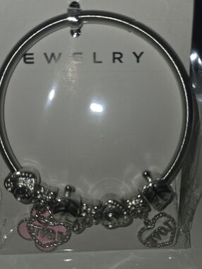Silver Tone Charm Bangle Bracelet with Pink Accents